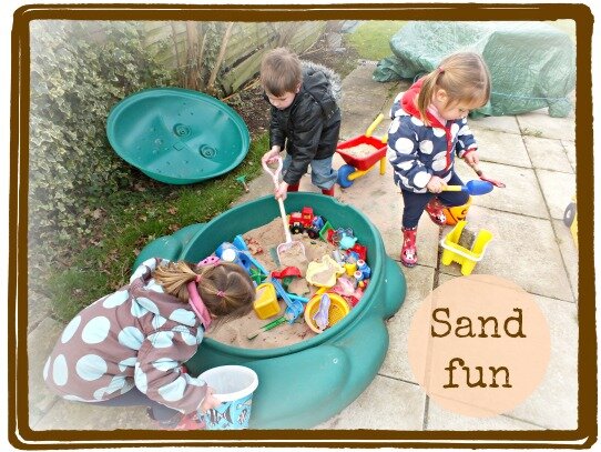 children having fun playing in sand